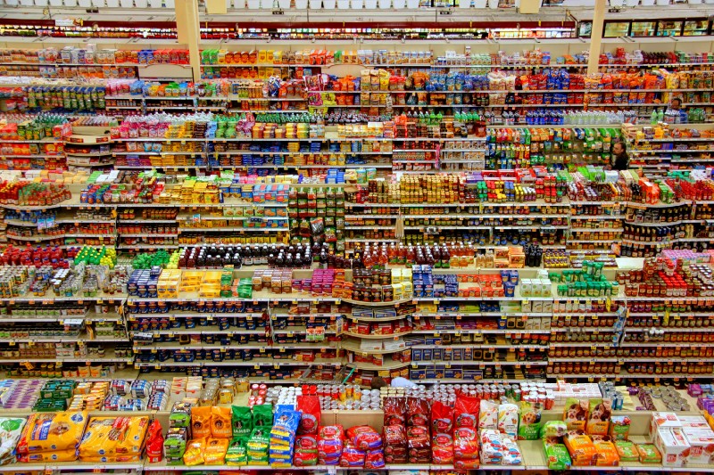 “high-angle photography of grocery display gondola” by Peter Bond